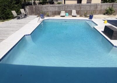 Renovated pool with raised spa fountain feature by Planet Pool Renovations in Orlando, FL