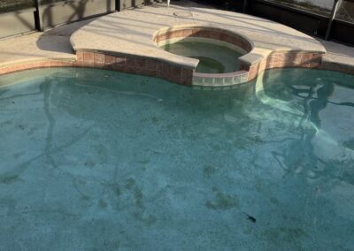 Outdated pool before renovation by Planet Pool Renovations in Orlando, FL