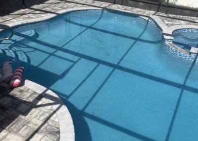 Freeform pool with attached spa after renovation by Planet Pool Renovations in Orlando, FL
