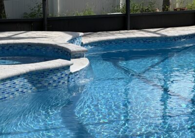 Close-up of new waterline tile after pool resurfacing by Planet Pool Renovations in Orlando, FL