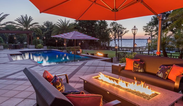 Pool with fire table and lounge seating